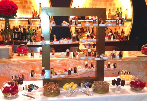 four tier wavy glass display stand Wing Lei Wynn Las Vegas MyGlassStudio