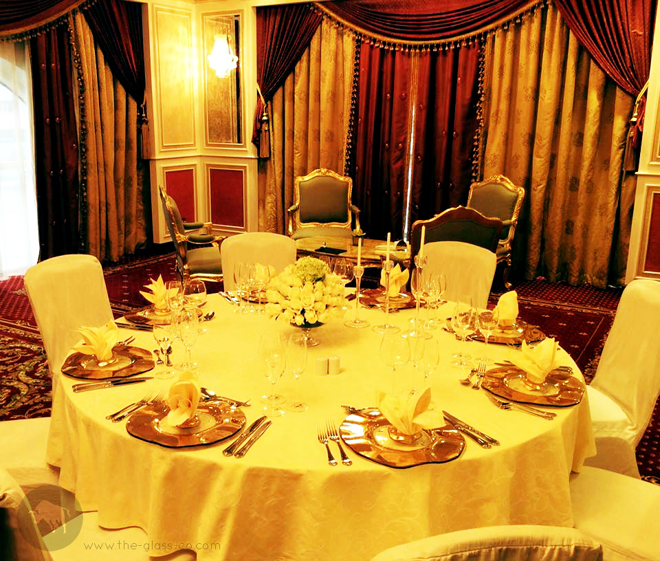Gold glass banqueting plates by MyGlassStudio for the Royal Rose Hotel