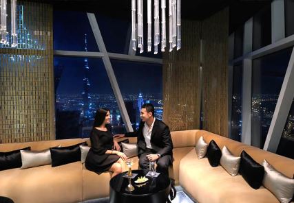 sleek dinnerware Vault bar JW Marquis Dubai black gold interior MyGlassStudio